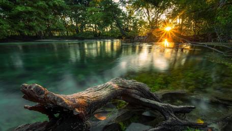 Sunset Sparkle by the Serene River wallpaper