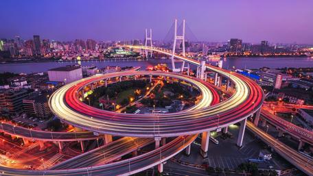 City Lights Reflecting on Twisting Expressway wallpaper