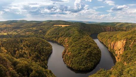 Serene River Bend Amidst Lush Greenery wallpaper