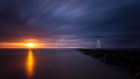 Serene Sunset at the Lighthouse wallpaper