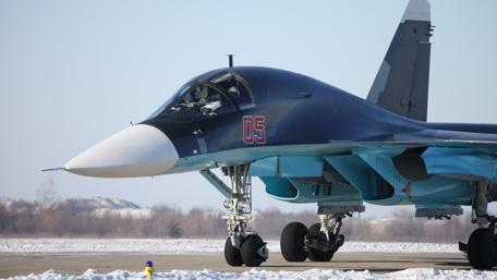 Sleek Su-34 Fighter Jet on a Winter Airfield wallpaper