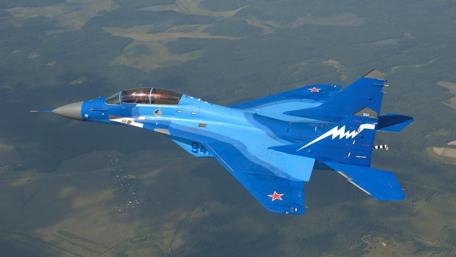 Blue Fighter Jet in Action Displaying Military Might wallpaper