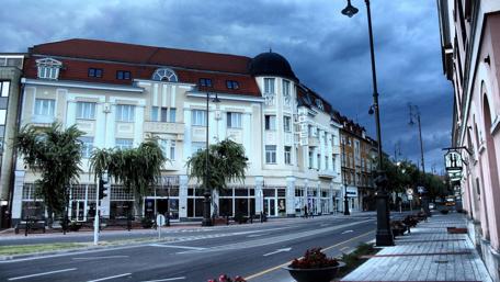 Urban Serenity Under Dark Clouds wallpaper