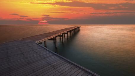 Sunset Serenity Over a Tranquil Pier wallpaper