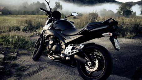 Mysterious Black Motorbike at Dusk wallpaper