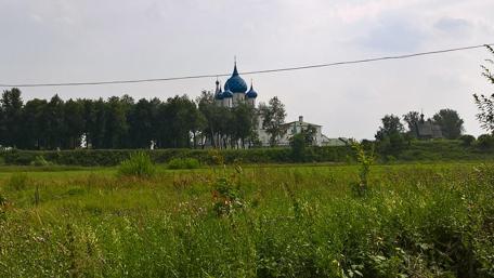 Tranquil Landscape with Blue Dome Church wallpaper