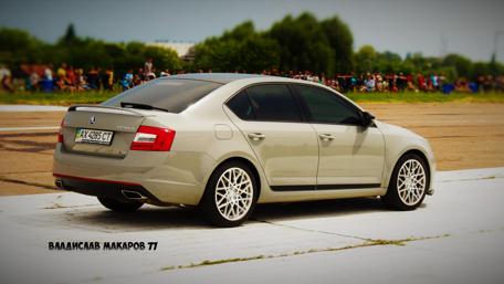 Sleek Sedan in Action Scene Wallpaper wallpaper