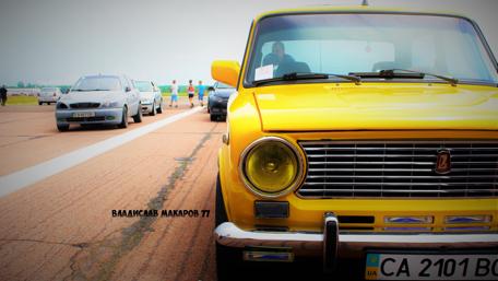 Bright Yellow Classic Car on the Road wallpaper