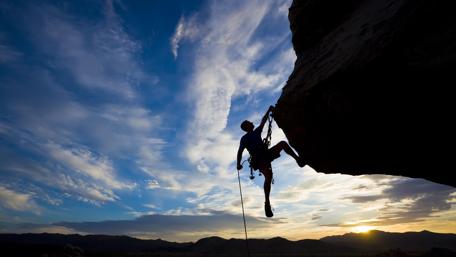 Sunset Ascent Silhouette Against a Fiery Sky wallpaper