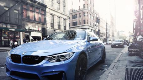 Sleek Blue Beauty on Urban Streets wallpaper