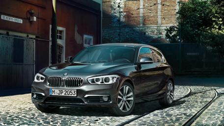 Sleek BMW Model on Cobblestone Streets wallpaper