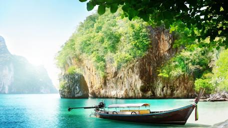 Serene Boat in Tranquil Blue Bay wallpaper