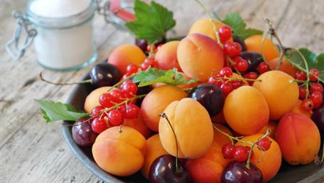 Vibrant Fresh Fruits Displayed in a Bowl wallpaper