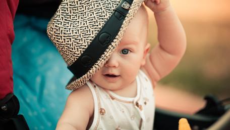 Joyful Baby with a Playful Hat wallpaper