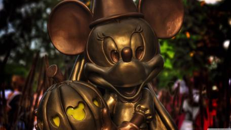 Charming Minnie Mouse Statue in Autumn Glow wallpaper