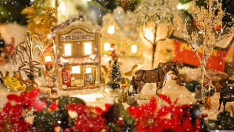 Charming Holiday Village Under Snowfall wallpaper