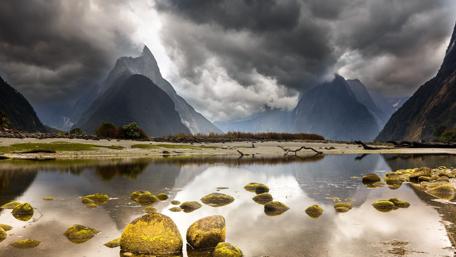 Majestic Mountains Under Ominous Skies wallpaper