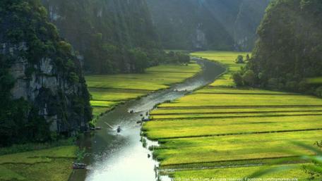 Serene River Flowing Through Lush Valleys wallpaper