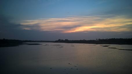 Serene Evening Sky Over Tranquil Waters wallpaper