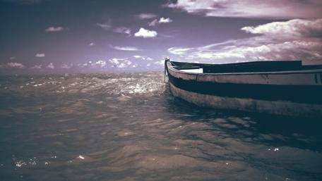 Serene Waterscape with Vintage Boat wallpaper