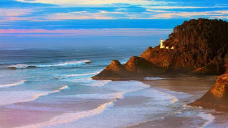 Serene Lighthouse by the Ocean Waves wallpaper