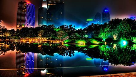 Vibrant City Lights Reflecting in Water wallpaper