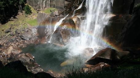 Majestic Waterfall and Rainbow Scene wallpaper