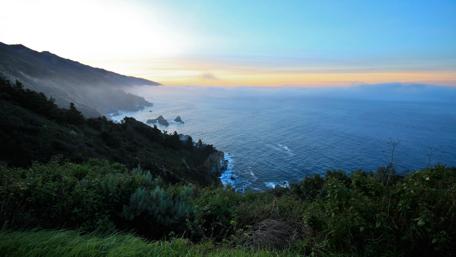 Serene Coastal Sunset Overlooking the Ocean wallpaper