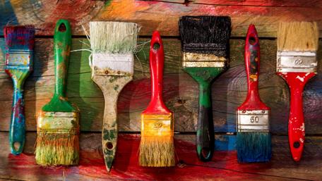 Colorful Paintbrushes on Wooden Canvas wallpaper