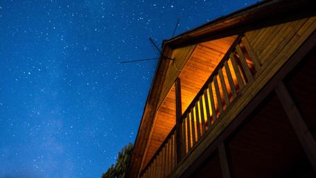 Starry Night Above a Suburban House wallpaper