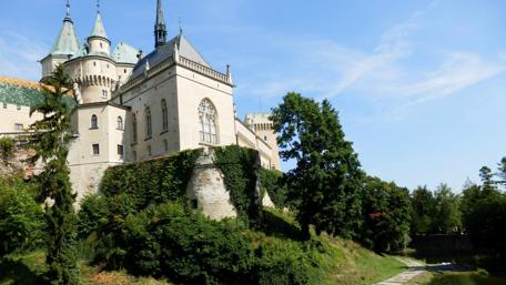 Majestic Castle Surrounded by Lush Nature wallpaper