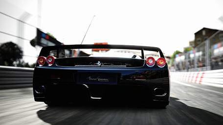 Sleek Black Sports Car on the Track wallpaper