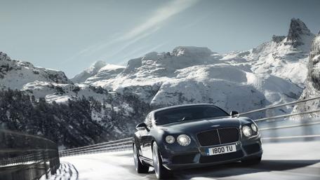Sleek Car in a Snowy Mountain Landscape wallpaper