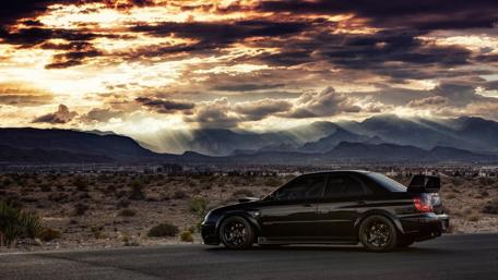 Black Beauty on a Desert Roadway wallpaper