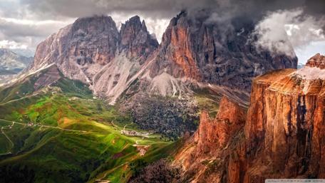 Majestic Mountain Peaks Under Dramatic Skies wallpaper