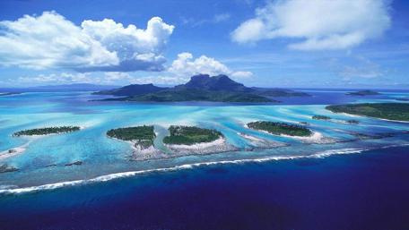 Breathtaking Aerial View of Tropical Islands and Clear Waters wallpaper
