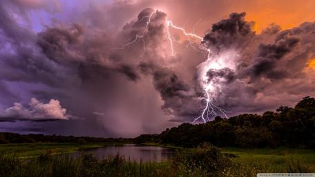 Powerful Storm Over Serene Waters wallpaper
