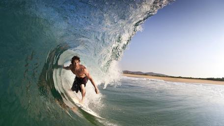 Epic Surfing Action in Clear Waves wallpaper