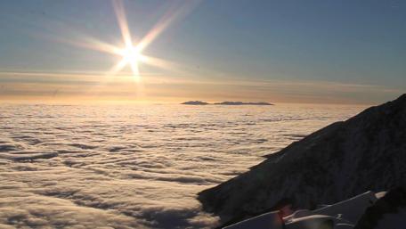 Majestic Sunrise Above the Clouds wallpaper