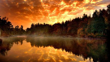 Fiery Sunset Over Serene Lake wallpaper