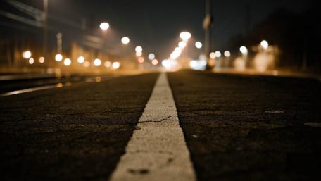 Urban Nightscape with Tracks and Lights wallpaper