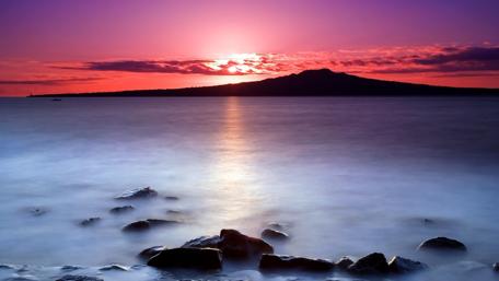 Misty Sunset Over Tranquil Waters wallpaper