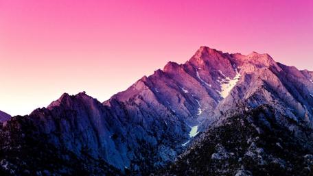 Pink Twilight Over Majestic Mountains wallpaper