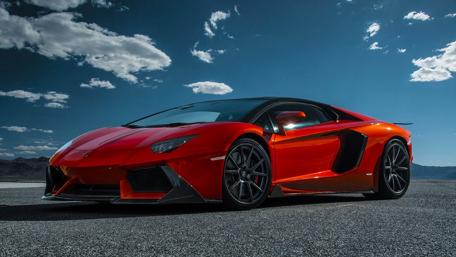 Fiery Red Lamborghini Under Majestic Skies wallpaper