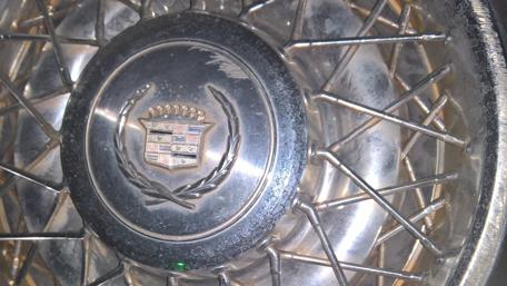 Classic Rusty Cadillac Wheel Close-Up Artistry wallpaper