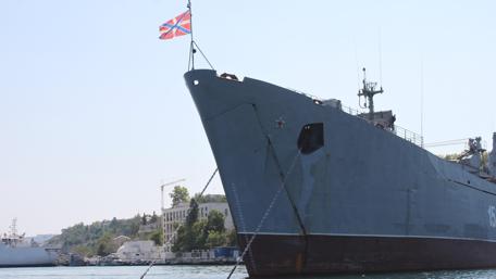 Imposing Warship at Dockside Scene in 4K Resolution wallpaper