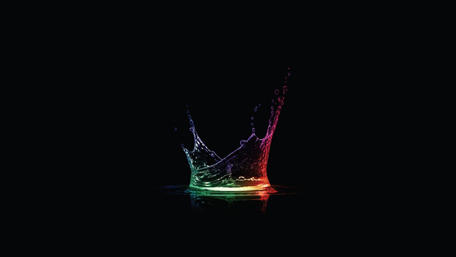Vibrant Water Splash in Darkness wallpaper