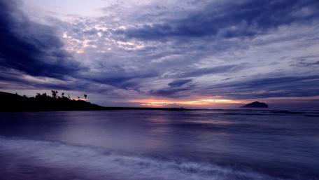 Serene Coastal Sunset Over Calm Waters wallpaper