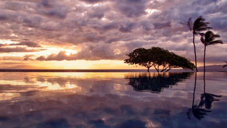 Serene Sunset Reflection Over Calm Waters wallpaper