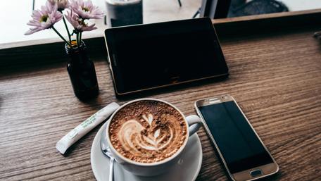 Cozy Coffee Break with Technology wallpaper
